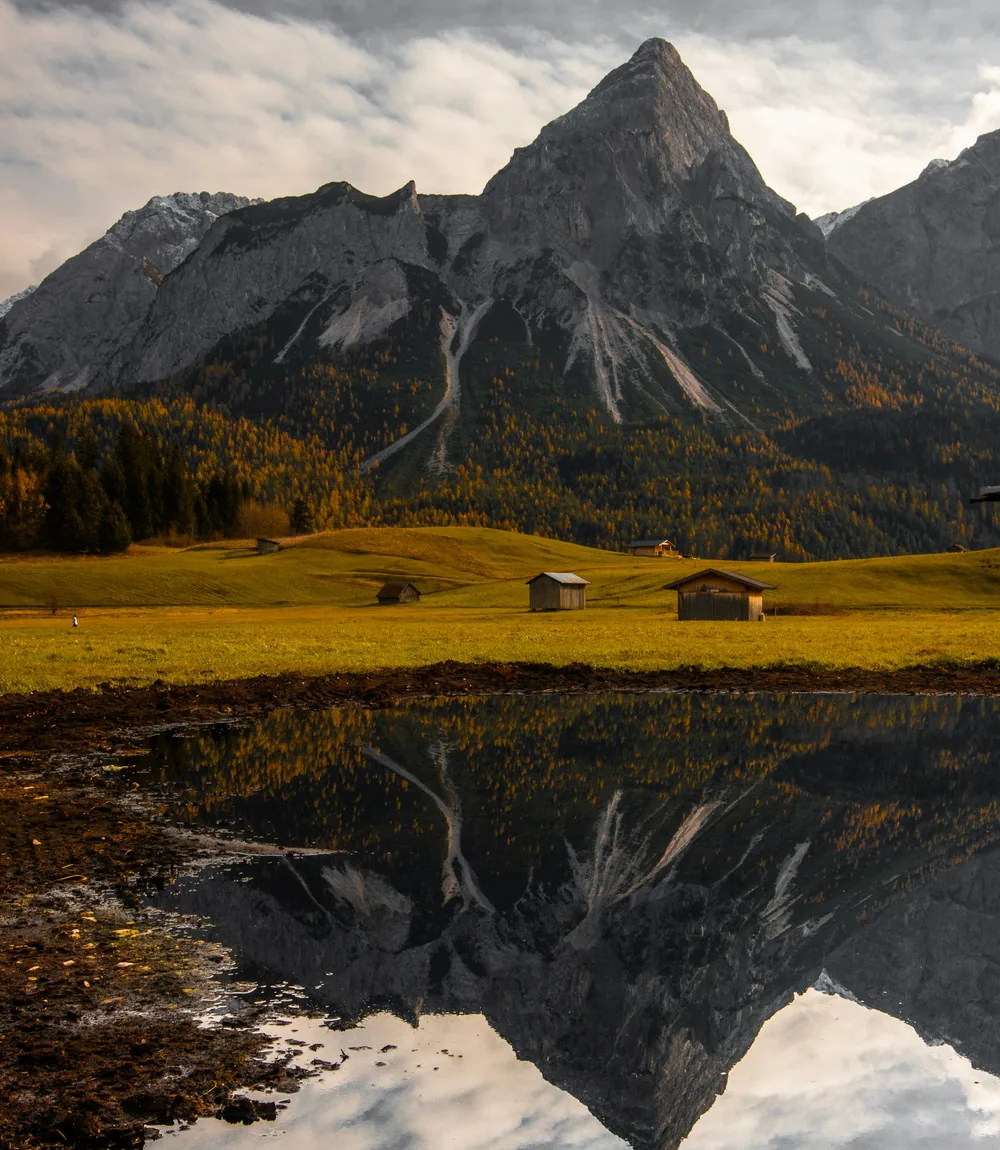 Mountains reflected in the still water of Lake Hallstatt